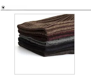 Close-up of ribbed knit winter scarves in brown, burgundy, dark grey and black colors