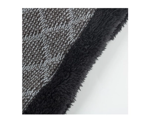 Detail of winter warm neck warmer with diamond knit texture and thick black fleece lining