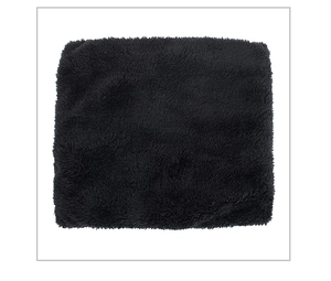Close-up of soft black plush neck warmer showing thick fleece texture and sewing details
