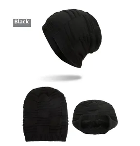 Detail view of black knit beanie with soft faux fur lining and thick ribbed texture