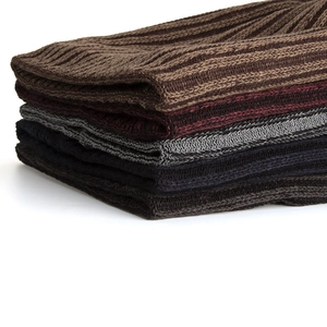 Winter ribbed knit beanies in multi-color stack featuring warm wool blend material