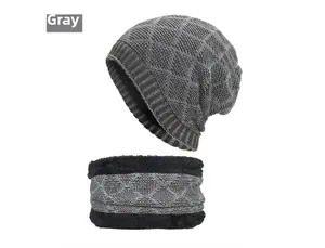 Detail view of winter knitted grey hat and neck warmer set with thick black fleece lining
