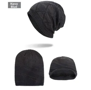 Detail view of navy blue knit beanie with diamond pattern and warm fleece lining