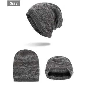 Detailed view of grey knit beanie featuring diamond patterns and thick black fleece lining