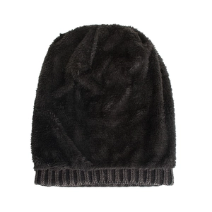 Thick warm dark brown knit beanie with plush faux fur texture and grey ribbed cuff