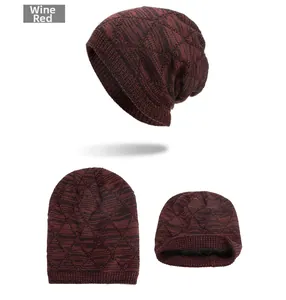 Detail of wine red knit beanie with diamond pattern and black fleece lining