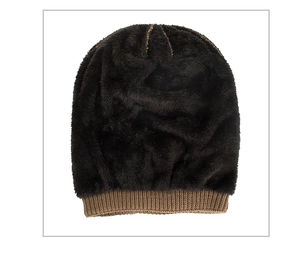 Detail of warm winter knit beanie showing soft plush faux fur lining and striped texture
