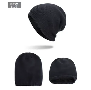 Macro detail of navy blue knitted beanie featuring a warm black fleece lining for winter