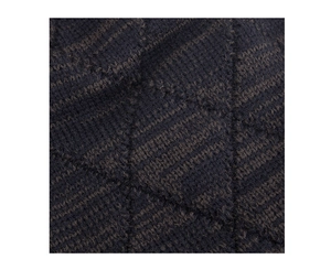 Detailed macro view of heavy knit fabric with navy and brown diamond pattern