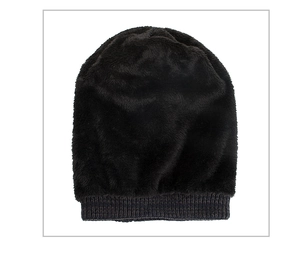 Close-up of winter knit beanie showing thick faux fur lining and ribbed texture detail