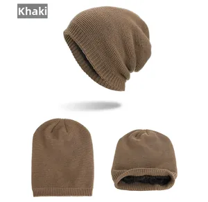 Detail view of khaki knitted beanie featuring a warm black fleece lining and fine texture