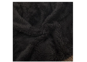 Macro shot of thick black fleece lining and brown knit edge for winter beanies