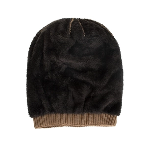 Winter knitted beanie featuring thick plush fleece lining and brown knit cuff detail
