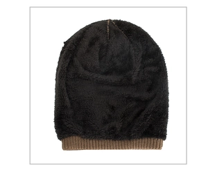 Detail of winter knit hat with warm black fleece lining and brown folded cuff