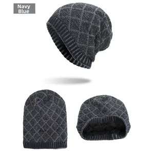 Close-up of navy blue diamond pattern knit hat with thick black fleece lining detail