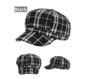 Detailed views of a black and white plaid newsboy cap in textured tweed fabric