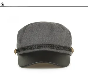 Detail view of dark grey fiddler cap with black PU visor and braided rope detail