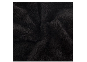 Close-up texture of high-density black faux fur plush lining for winter knit hats