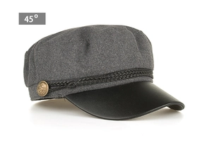 Detail view of newsboy cap with grey wool texture and black PU leather brim