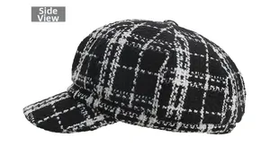 Side view detail of a classic black and white checkered tweed newsboy cap for women