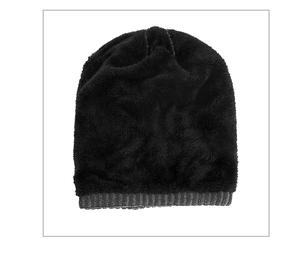 Close-up of black cable knit winter hat featuring warm fleece lining and gray ribbed cuff