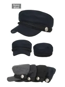 Detail of nautical military cap showing braided rope, anchor buttons and color variety