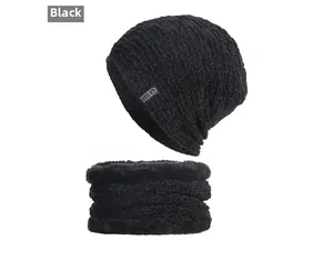 Close-up of black ribbed knit winter hat and fleece-lined neck warmer with leather patch