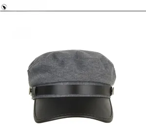 Close-up of gray knit fabric mixed with black leather brim and golden side buttons