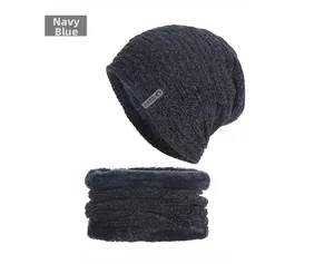 Detail of navy blue fleece-lined knit beanie and neck warmer with rib texture