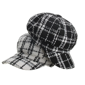 Classic black and white tweed newsboy caps with vintage checkered texture for women