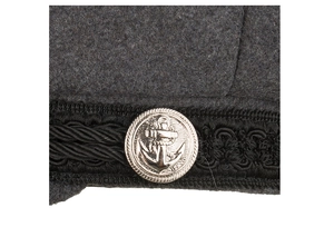 Detail shot of the wool military cap showing the silver anchor button and braided strap