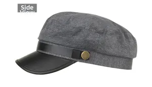 Side view of grey wool newsboy hat with black faux leather brim and metallic button detail