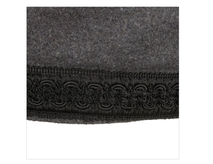 Detail of dark grey wool felt texture with intricate black braided trim on military beret