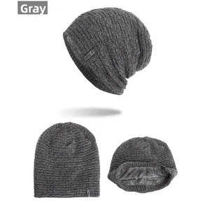 Detail view of dark gray knit hat featuring thick fleece lining and Care True logo label