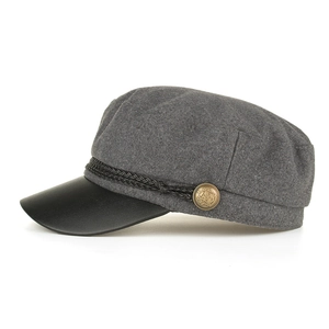 Vintage gray wool newsboy cap with black leather brim and decorative braided cord