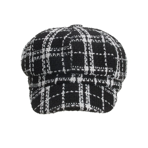 Classic black and white checkered tweed newsboy cap for women in a vintage autumn style