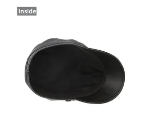 Detail view of the gray newsboy cap interior lining and black leather brim