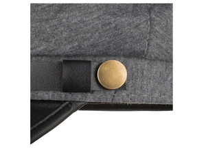 Detail of grey knitted wool beret with black faux leather strap and golden metal buckle