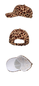 Detail view of leopard print baseball cap with adjustable silver metal buckle and inner lining