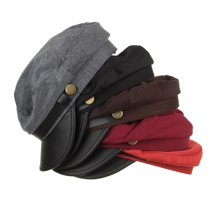 Classic baker boy caps in five colors with leather brims and metal side buckles