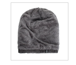 Close-up of dark grey knit beanie featuring a soft fleece lining and POWER label