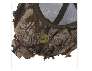 Close-up detail of leaf camouflage baseball cap with golden branded sticker on brim