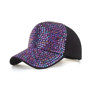 Close-up of colorful gradient rhinestones on black baseball cap with vibrant sparkles
