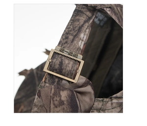 Detail shot of the adjustable bronze metal buckle on the camo military fatigue cap