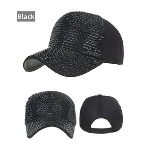 Detail showing the adjustable snapback closure and rhinestone finish on the black baseball cap