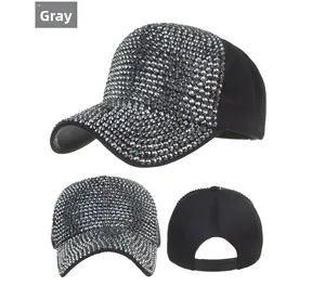 Detail view of grey baseball cap with sparkling rhinestones and adjustable snapback closure