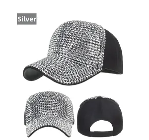 Detail view of silver rhinestone baseball cap showing front sparkle and back strap