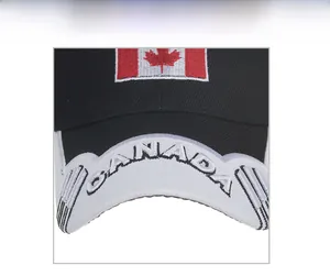 Close-up of Canada flag maple leaf embroidery and letter text on a baseball cap