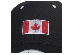 Close-up of Canadian flag maple leaf embroidery on black cotton twill baseball cap