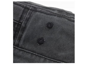 Detail of washed cotton military cap showing neat stitching and embroidered ventilation eyelets